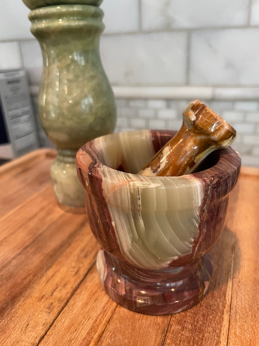small brown and green onyx mortar and pestle